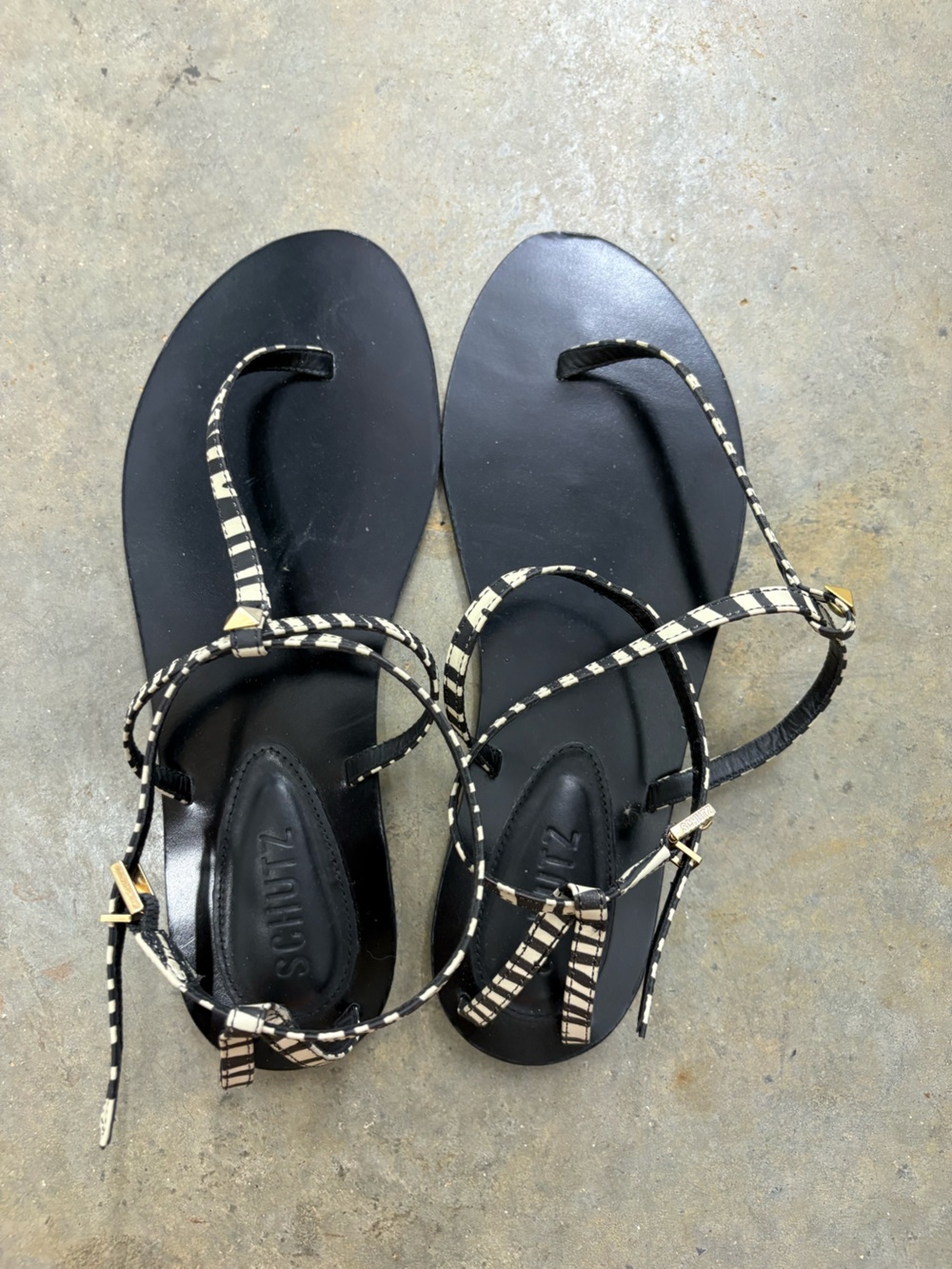 SCHUTZ Black Leather Zebra-Print Thong Sandals with Gold Accents